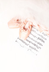 Ballet shoes, skirt and music sheet