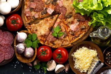 pizza with sausage and cheese and variety of ingredients