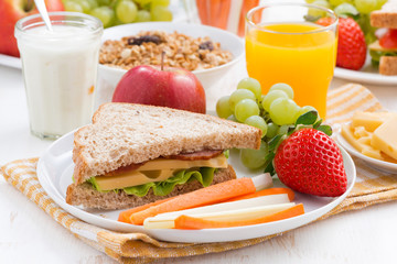 school breakfast with fruits and vegetables on plate
