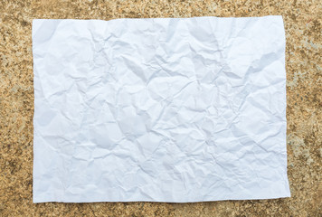 crumpled paper placed on cement background