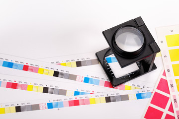 CMYK Color scales and loupe used for printing process