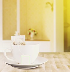 a cup of healthy green tea on plank, indoor background