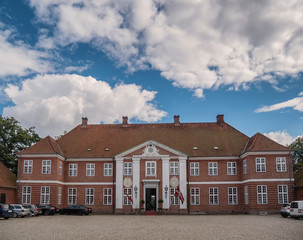 Hindsgavl Castle main entrance with flags