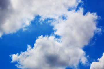 Naklejka na ściany i meble fluffy cumulonimbus cloud in the blue sky