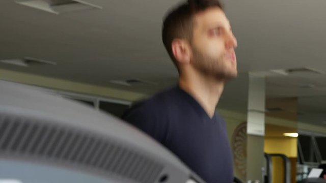 Man at the gym doing exercise on the treadmill