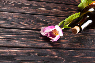 Tulip and wine on wood