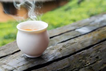 hot green tea on wood table
