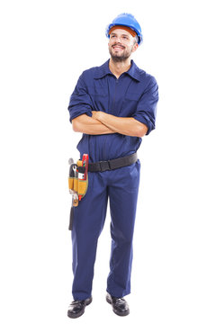 Young worker with arms crossed on white background