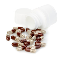 Brown capsules close-up on a white background.