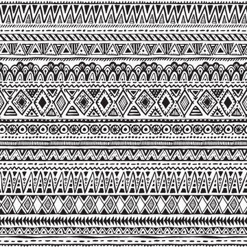 Vector seamless pattern with black and white hand drawn ethnic elements.