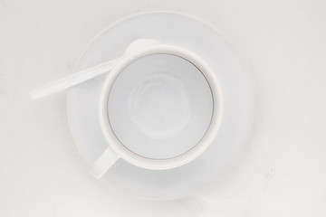 Coffee cup / Empty coffee cup with coffee stains on white background. Top view.