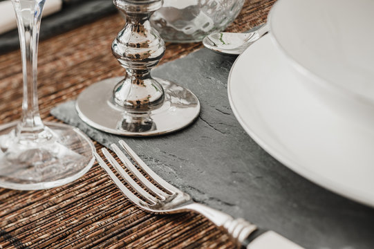Silver utensils on dining table