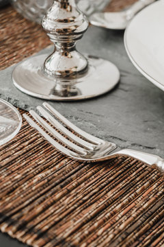 Silver tableware on table