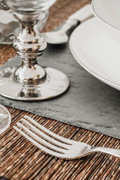 Close-up of silver kitchenware on dining table