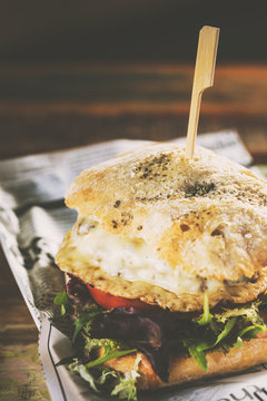 Delicious burger with beef and cheese on metal plate