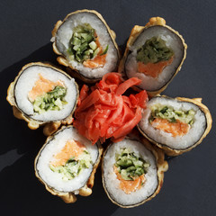 Sushi over black background