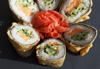 Sushi over black background