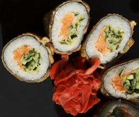Sushi over black background