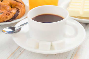 cup of black coffee on wood
