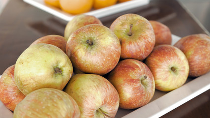Fresh applle fruits on breakfast in a restaurant. Enjoying sweet fruits on summer vacation. Healthy food concept