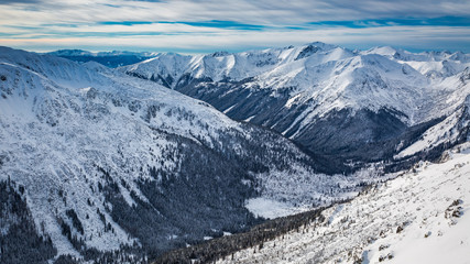 Fototapeta na wymiar Winter view of the valley from Kasprowy Wierch in Tatra Mountains, Poland