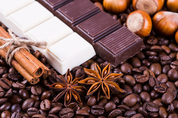coffee beans and chocolate on a wooden background