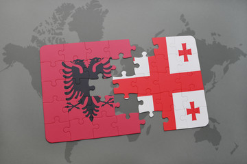 puzzle with the national flag of albania and georgia on a world map background.