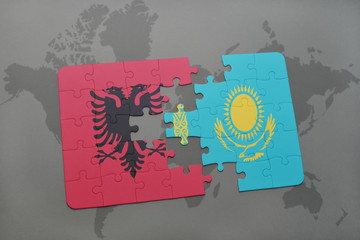 puzzle with the national flag of albania and kazakhstan on a world map background.