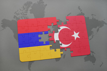 puzzle with the national flag of armenia and turkey on a world map background. © luzitanija