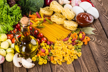 The composition of the pasta and vegetables on a white backgroun