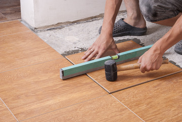 laying tiles on the floor