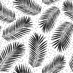 Summer tropical palm tree leaves seamless pattern on abstract confetti background. Vector grunge design for cards, wallpapers and natural product.