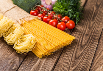 The composition of the pasta and vegetables on a white backgroun