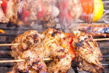 Close-up of a chicken shawarma kebab cooking on a on a barbecue