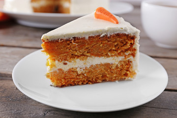 Delicious carrot cake on wooden table