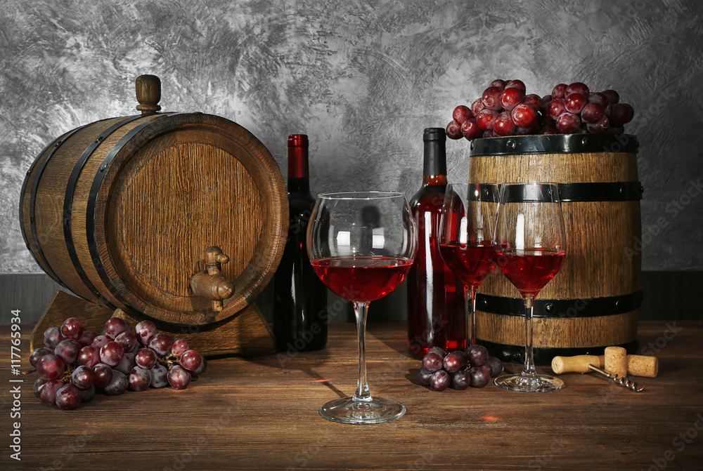 Canvas Prints glasses of red wine, grapes and barrel on a wooden table