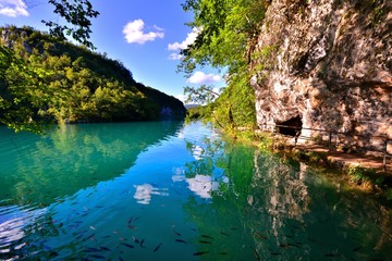 Fototapeta na wymiar Blue waters with reflections at Plitvice Lakes National Park, Croatia