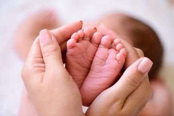 tiny foot of newborn baby