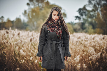 Portrait of beautiful girl in autumn park