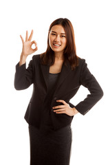 Young Asian business woman show OK sign.