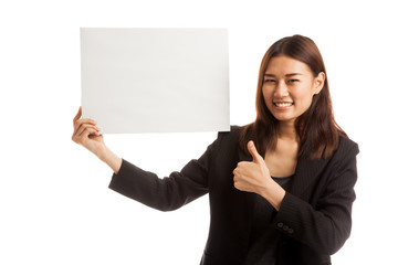 Young Asian business woman show thumbs up with  white blank sign