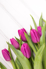 tulip bouquet on white wooden background