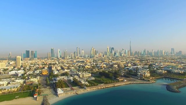 Aerial view Dubai downtown horizon panorama cityscape from Maritime city video 4k. Skyscrapers modern buildings Travel tourism business in United Arab Emirates