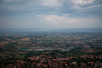 Fototapeta premium Modern San Marino Suburban districts and Italian hills view from