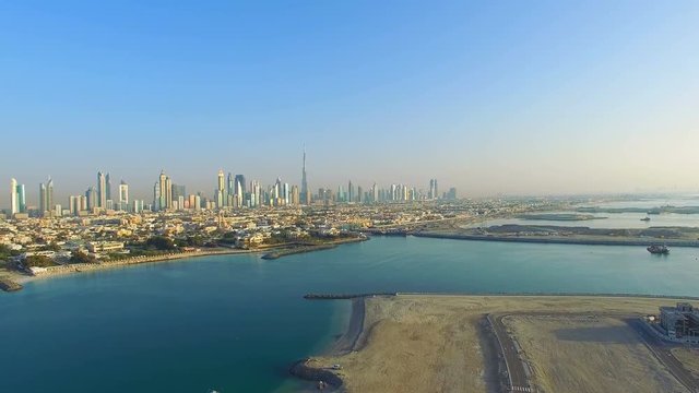 Aerial view Dubai downtown horizon panorama cityscape from Maritime city video 4k. Skyscrapers modern buildings Travel tourism business in United Arab Emirates