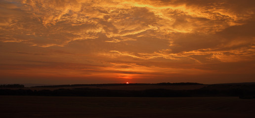 Fototapeta na wymiar Red orange sunrise in Palava area