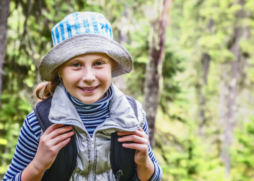 Girl walks in the forest.