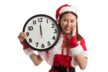 Asian Christmas Santa Claus girl and clock at midnight.