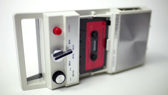old audio cassettes in a retro tape player