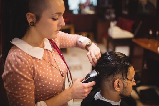 Man getting his hair trimmed with trimmer
